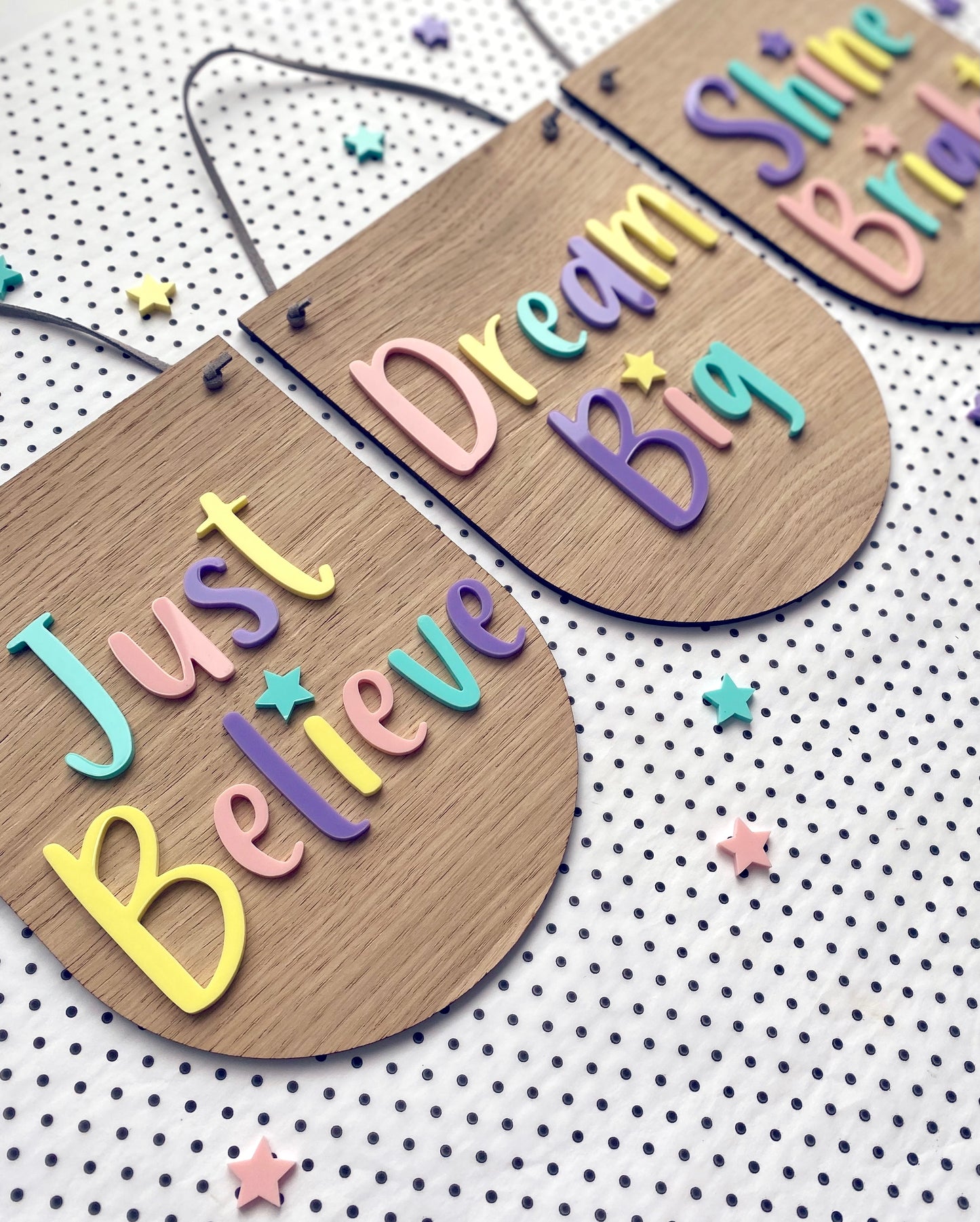 3 positive wooden wall hangings with colourful pastel lettering