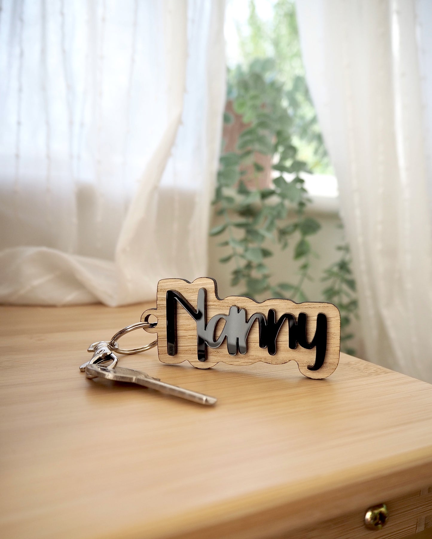 Black and wooden Nanny key ring