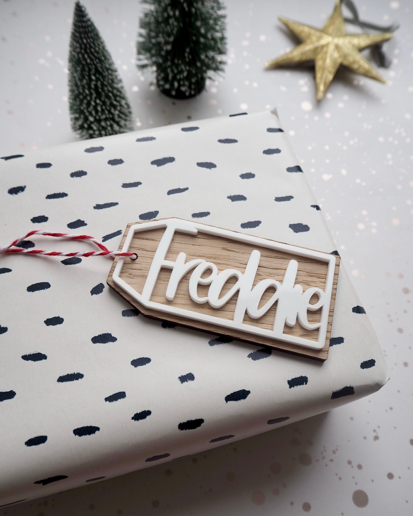 Personalised wooden Christmas gift tag with red and white string