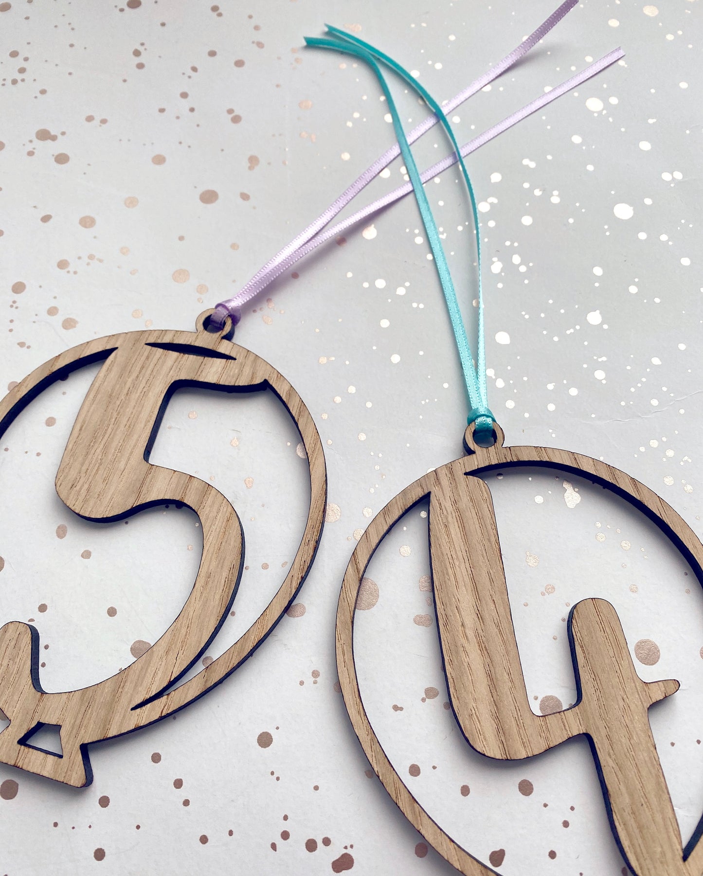 Wooden age birthday gift tags, laser cut from wood in a balloon shape. lilac and mint green ribbons attached
