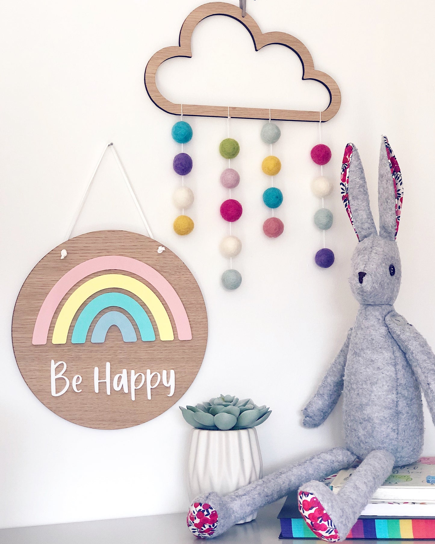 Wooden rainbow plaque with pom pom cloud and bunny soft toy