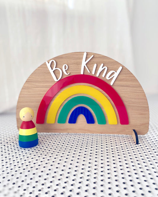 Wooden freestanding rainbow with colourful acrylic and the words Be Kind
