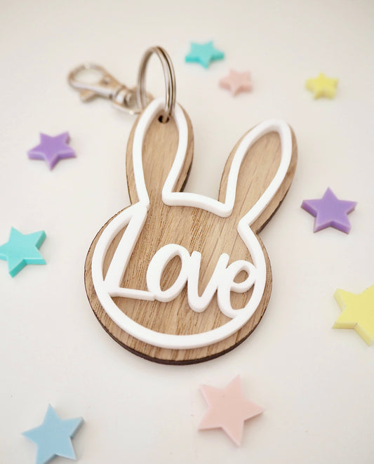 Wooden bunny key ring with white acrylic outline and the word Love