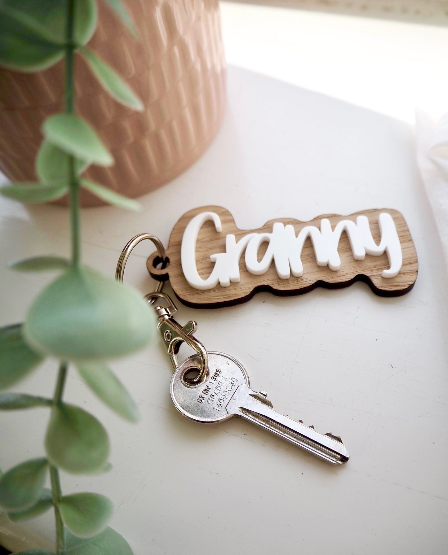 Wooden key ring with the word Granny in white acrylic