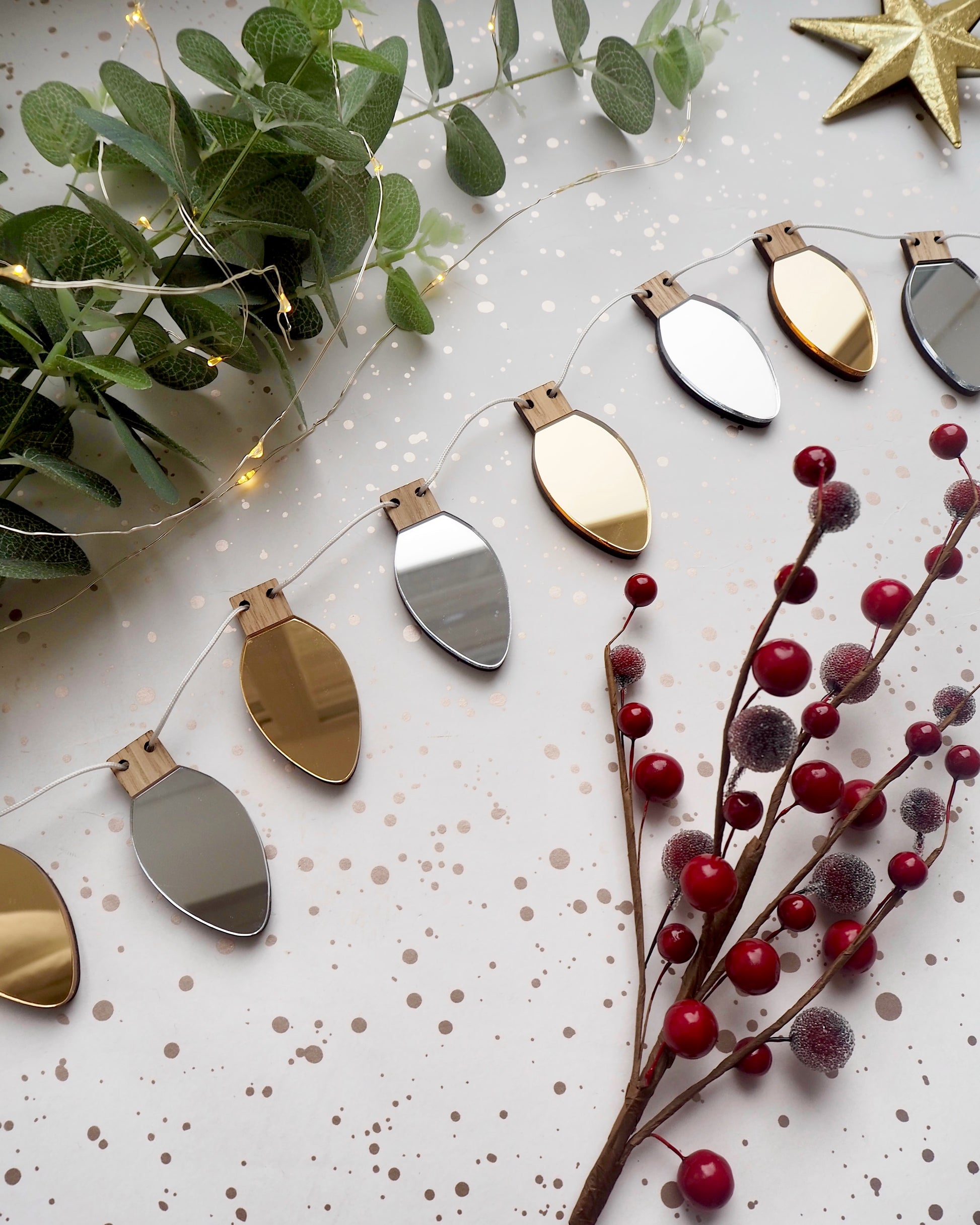 Metallic silver and gold Christmas garland in the shape of fairy lights