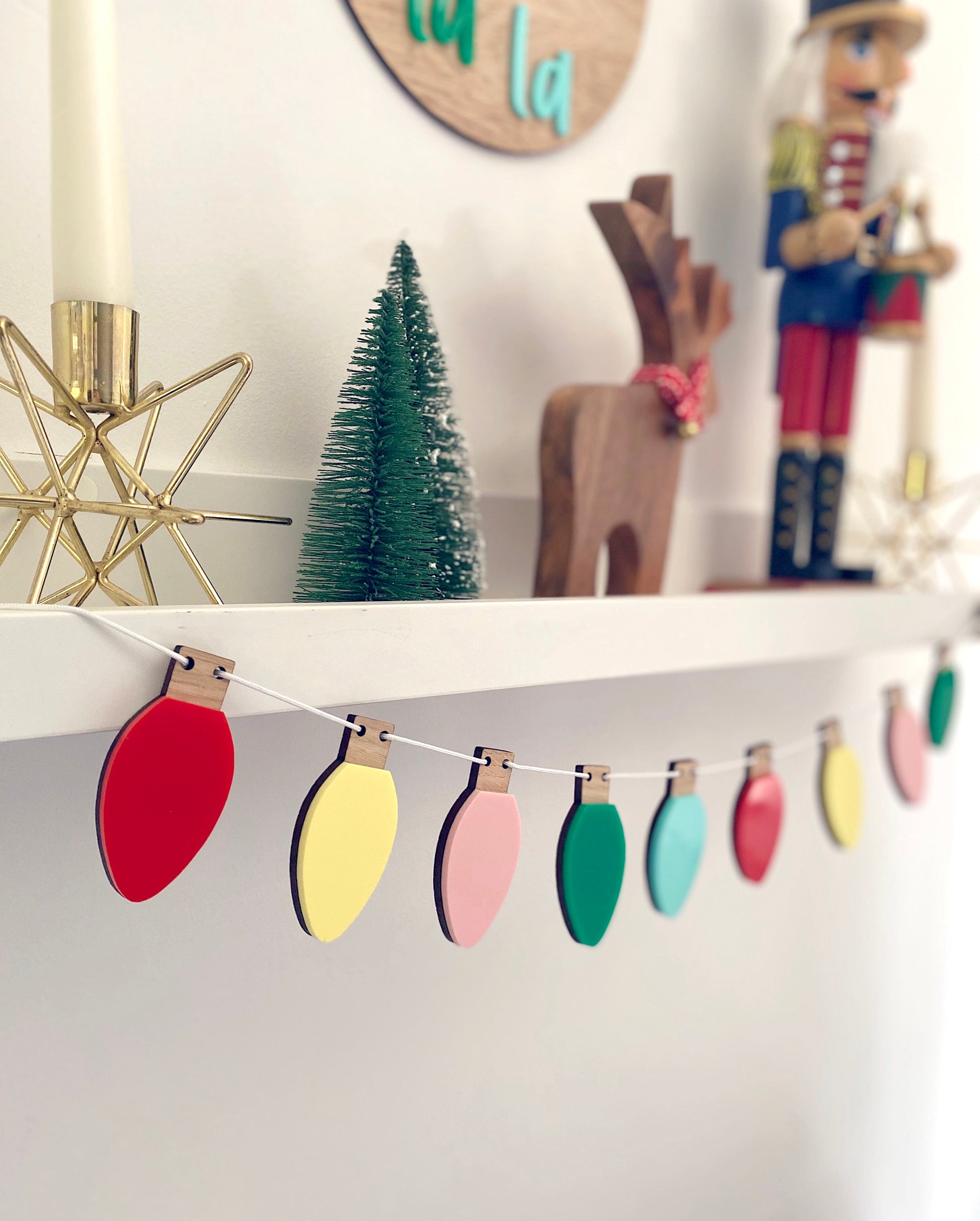 Multicoloured christmas lights hanging from a shelf