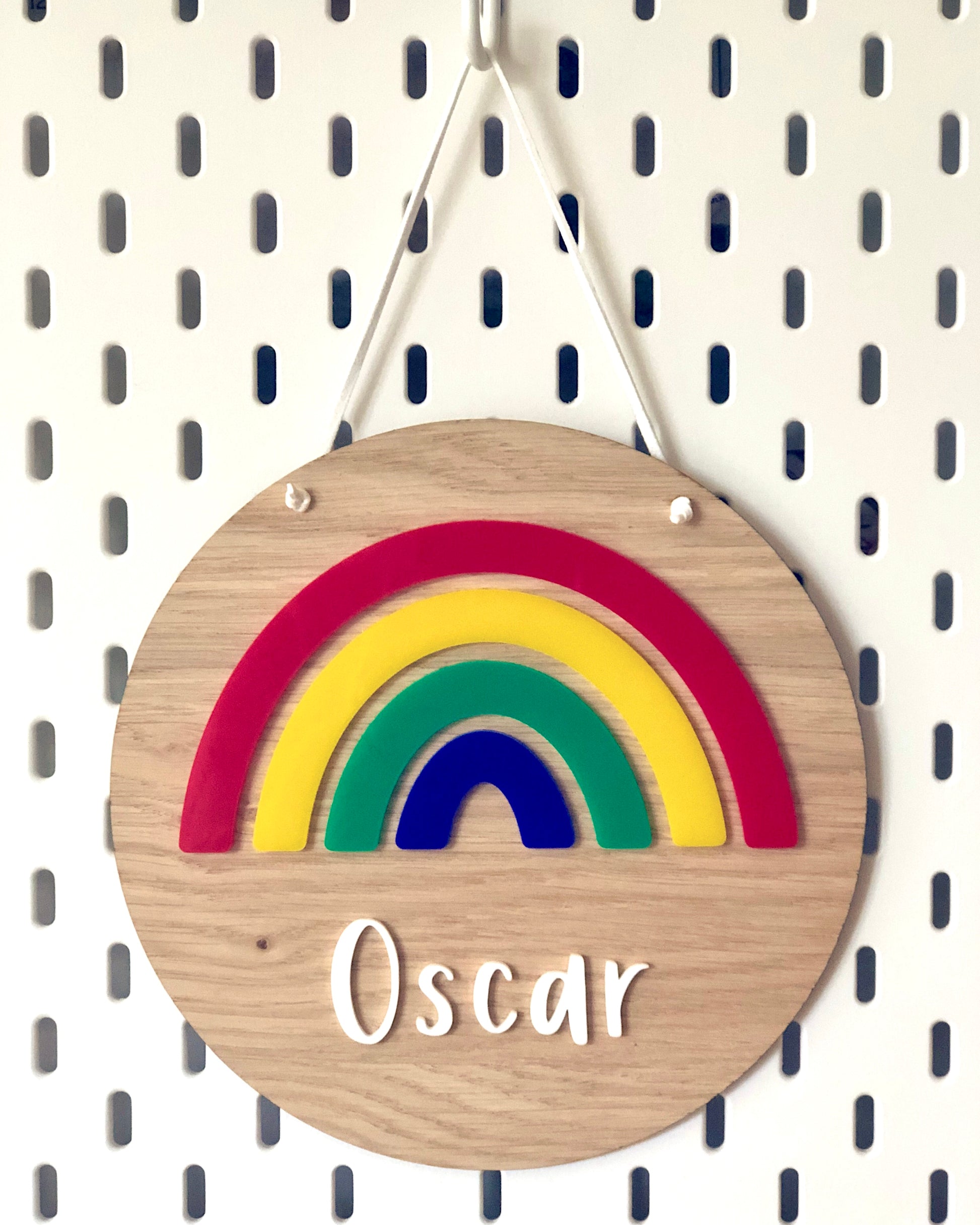 personalised wooden plaque with colourful acrylic rainbow and name 