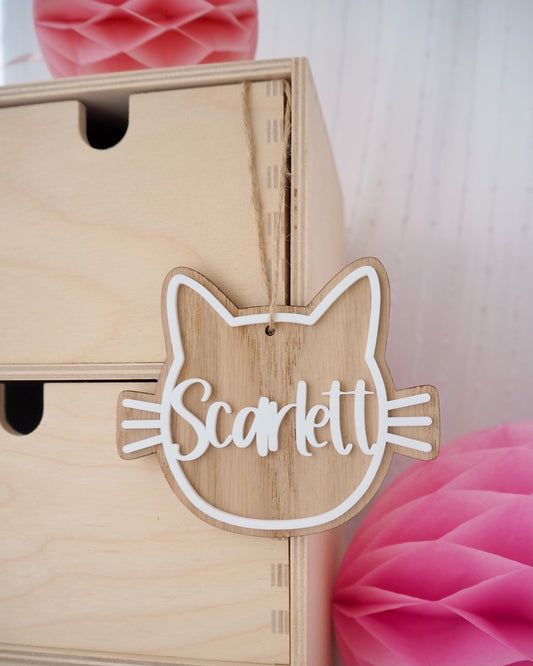 wooden cat decoration with name and whiskers attached in white acrylic