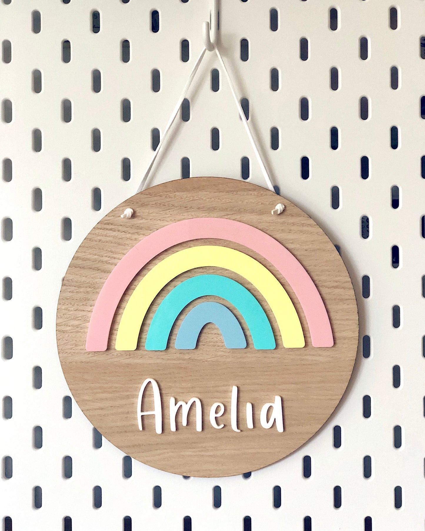 personalised wooden plaque with pastel acrylic rainbow and name 