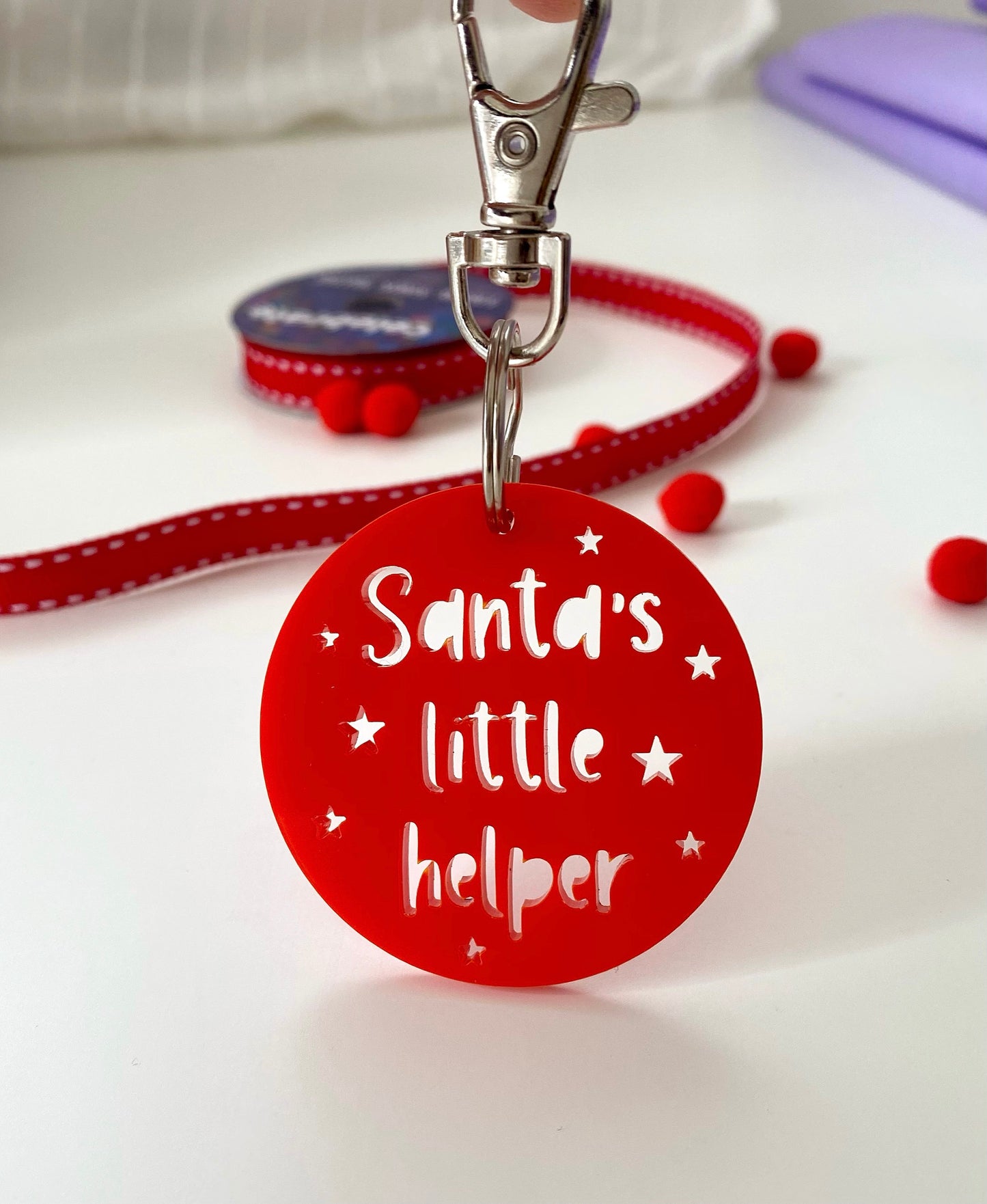 Red Santa's little helper key ring with cut out stars