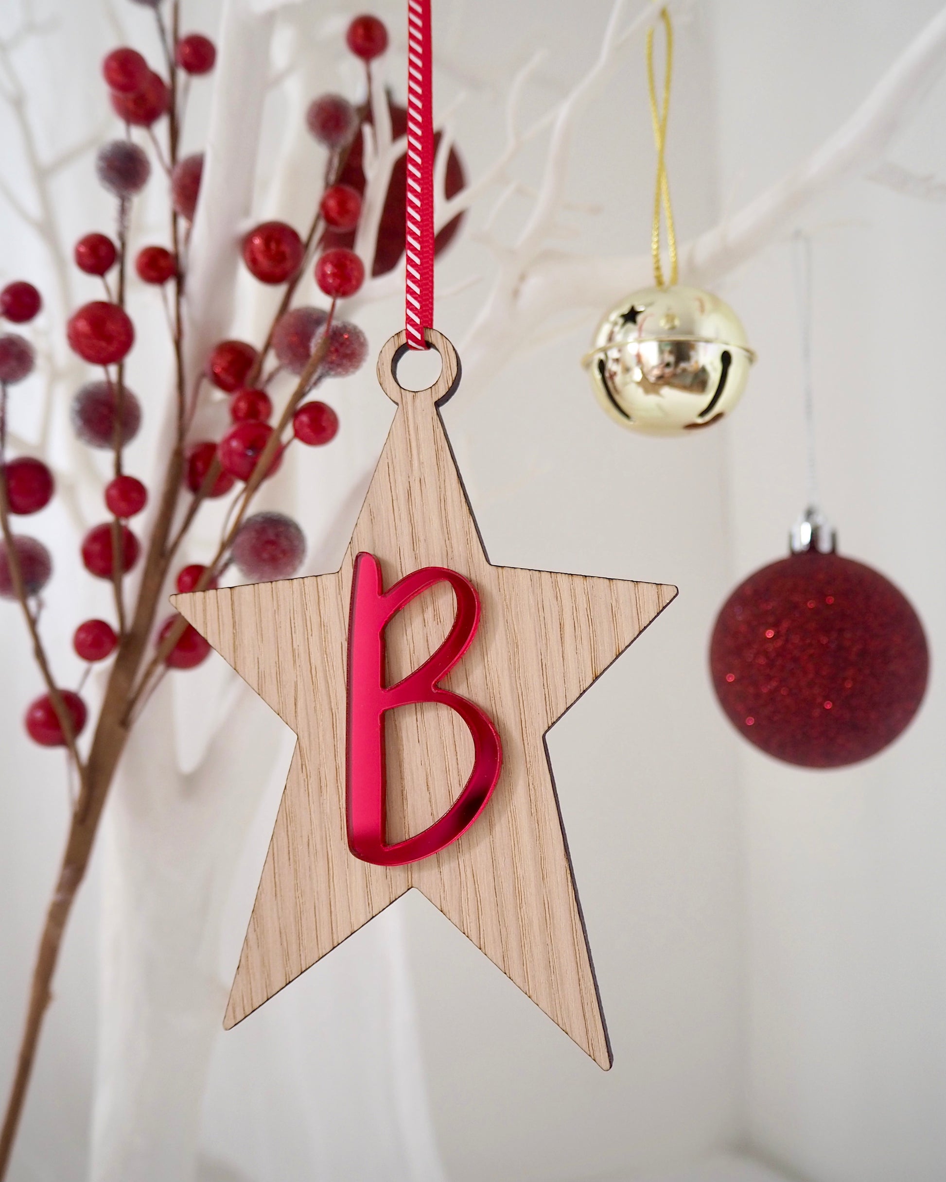 Wooden star Christmas decoration with metallic red B