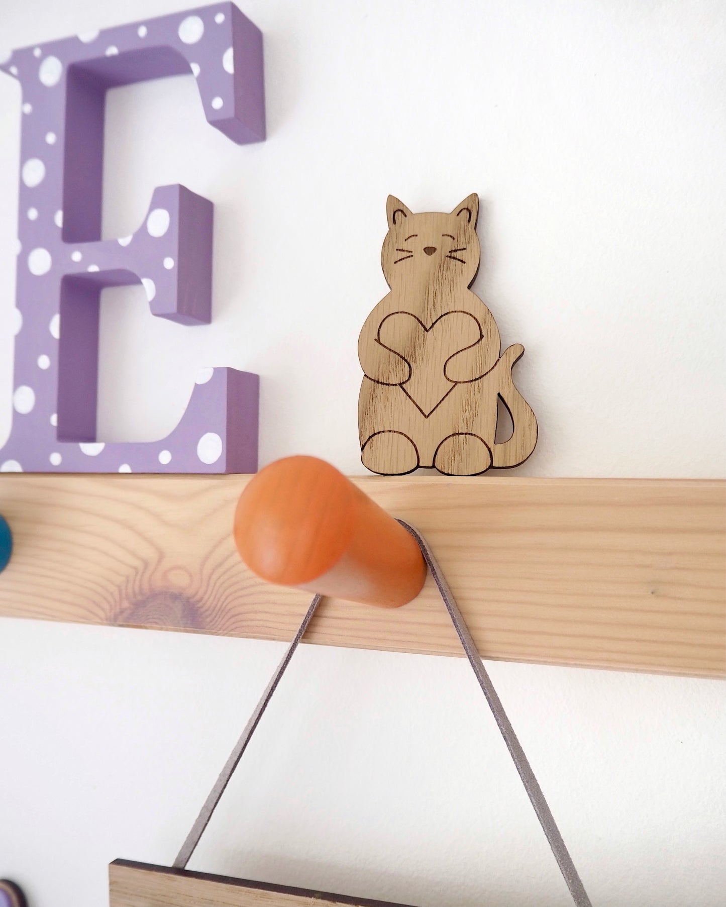 wooden laser engraved cat holding a heart