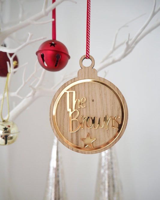 Personalised family Christmas bauble made from wood and metallic gold acrylic