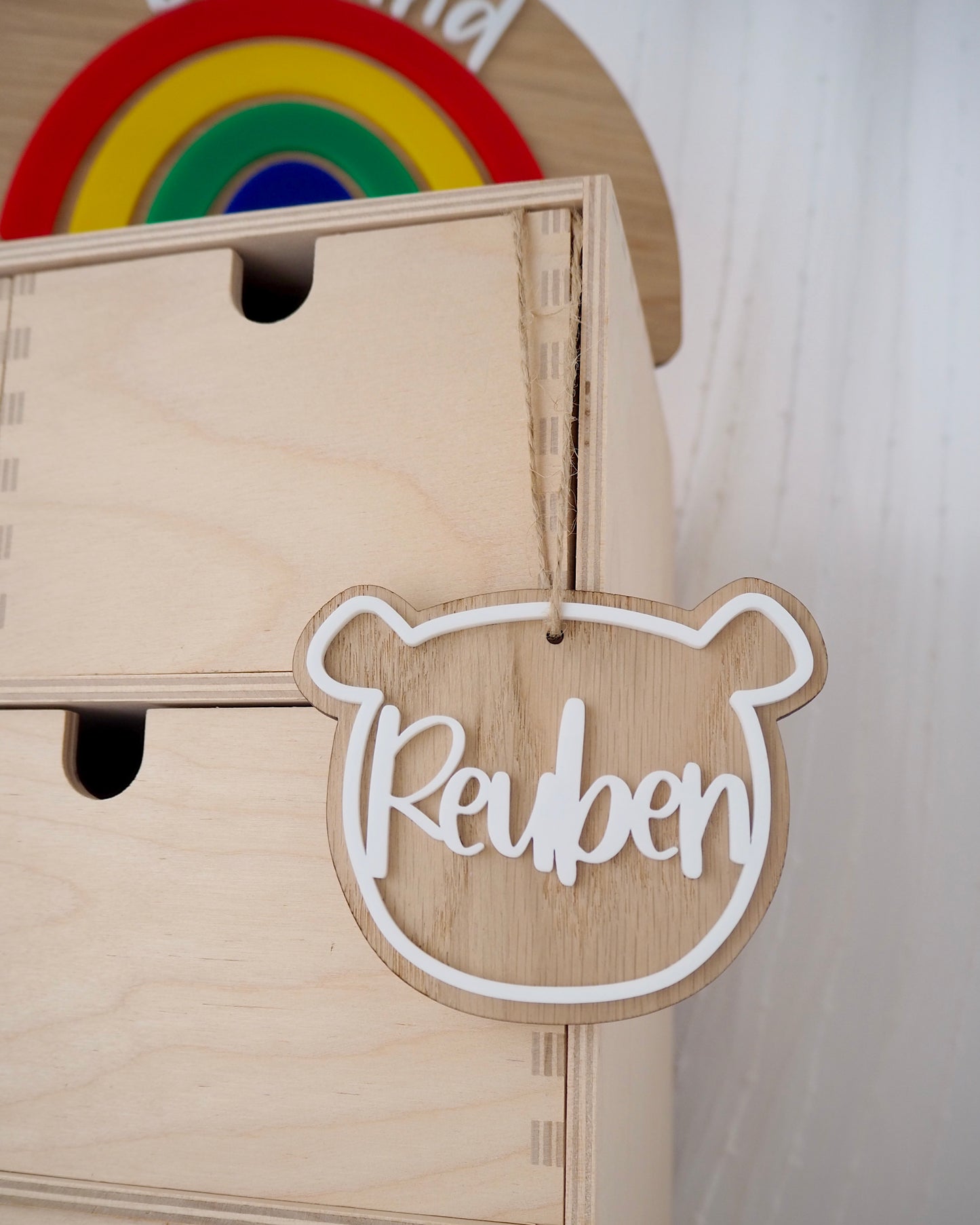 wooden bear with white laser cut acrylic name attached