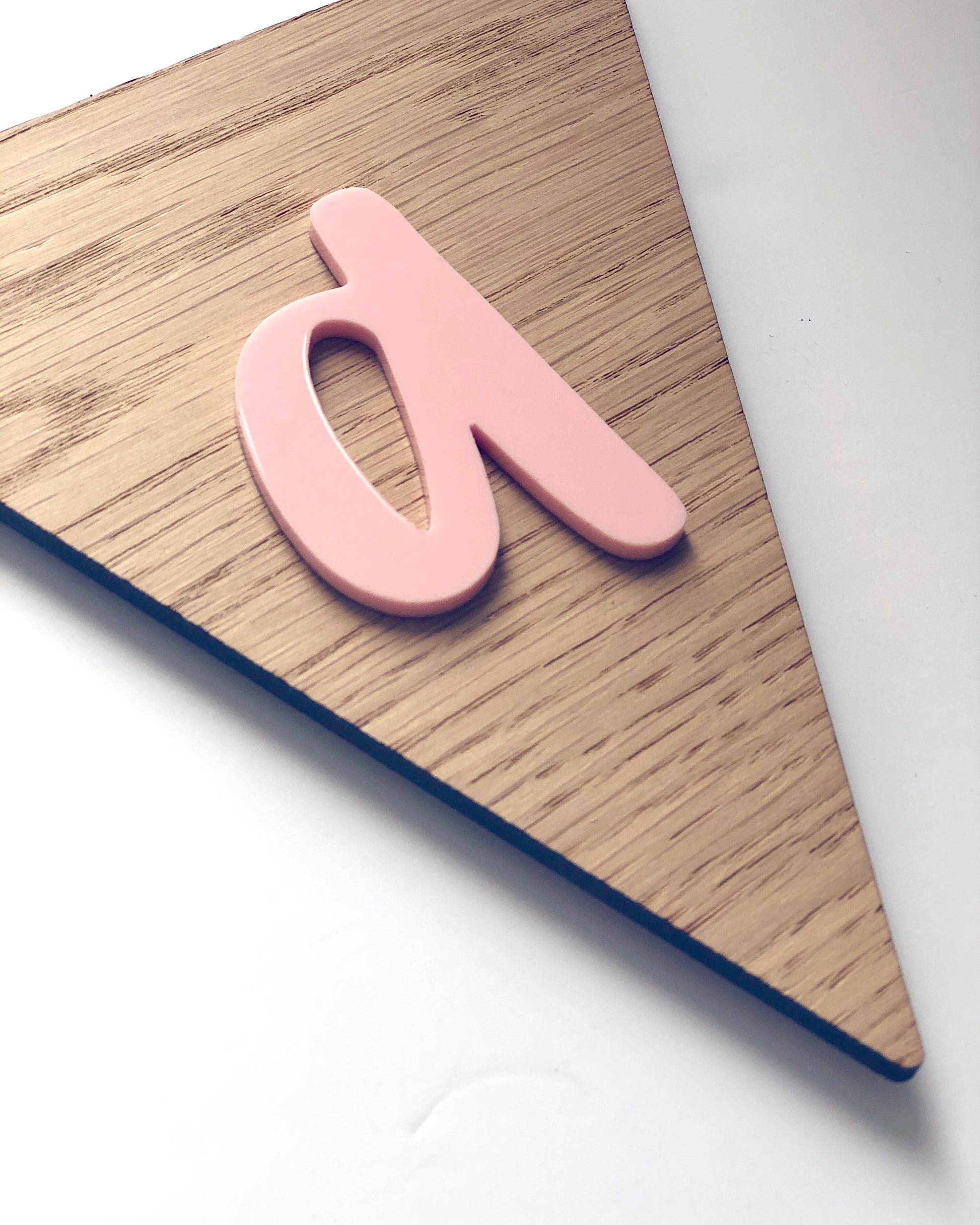 wooden bunting flag with pink acrylic letter